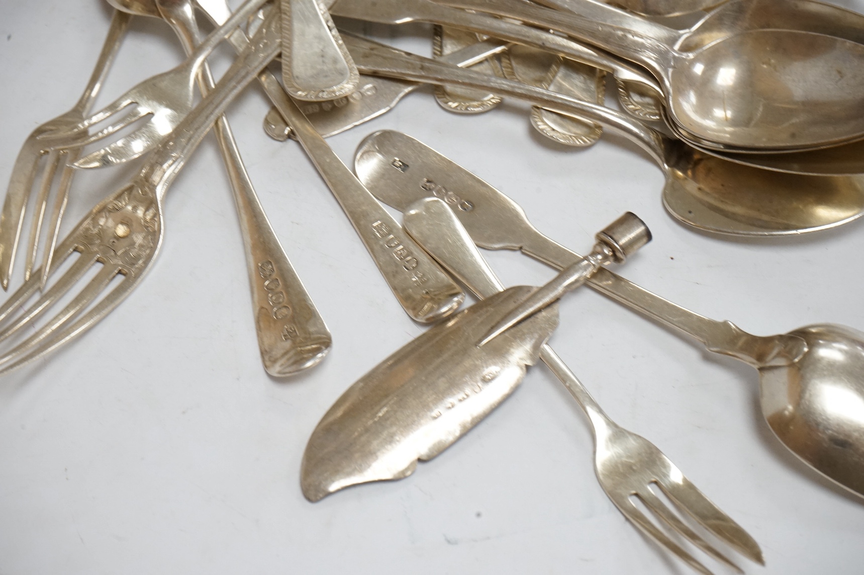 A set of six Elizabeth II silver feather edge Old English pattern soup spoons by James Dixon & Sons, Sheffield, 1968, 16.6cm, together with fourteen items of assorted 19th century and later silver flatware, three silver